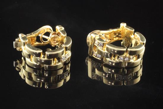 A pair of Cartier 18ct gold and diamond set pierced link half hoop earrings,